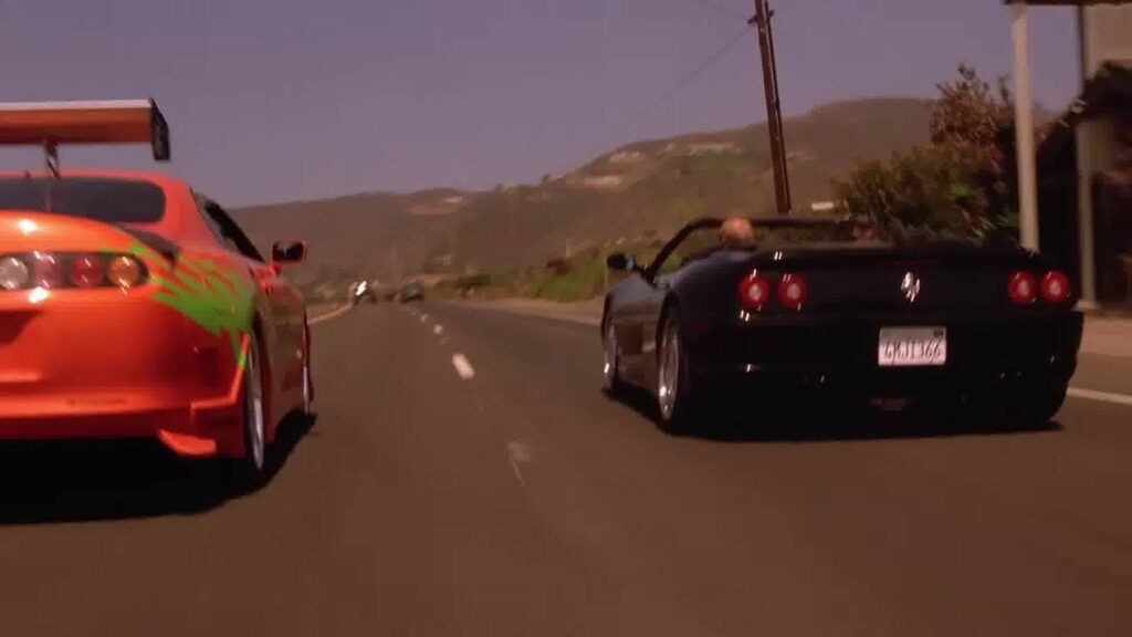 Two sports cars on the highway