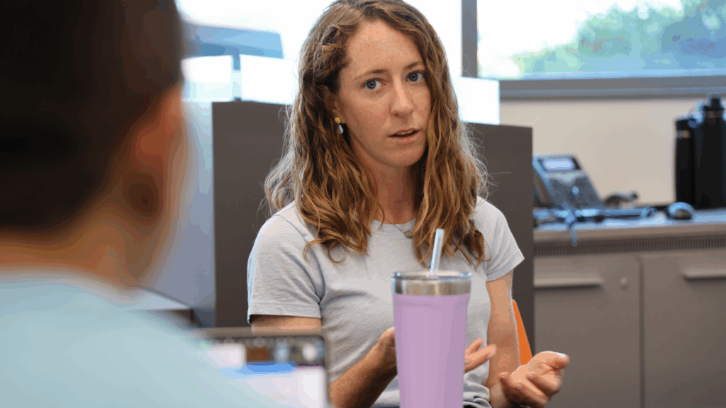 A professor speaks to a student.